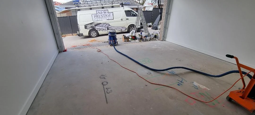 Concrete garage interior with van and equipment