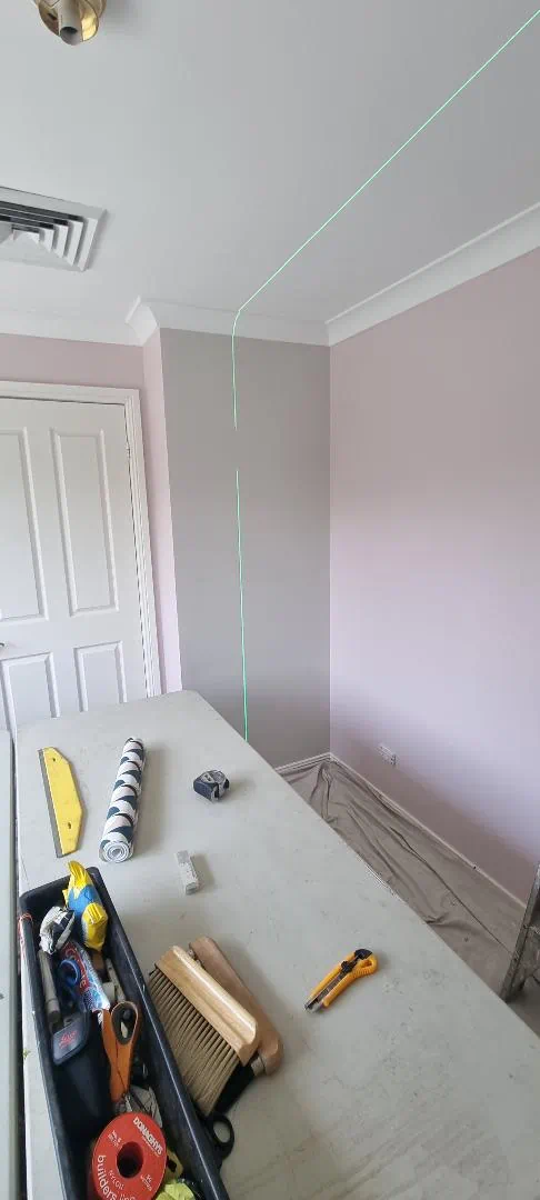 Interior renovation with laser level and tools