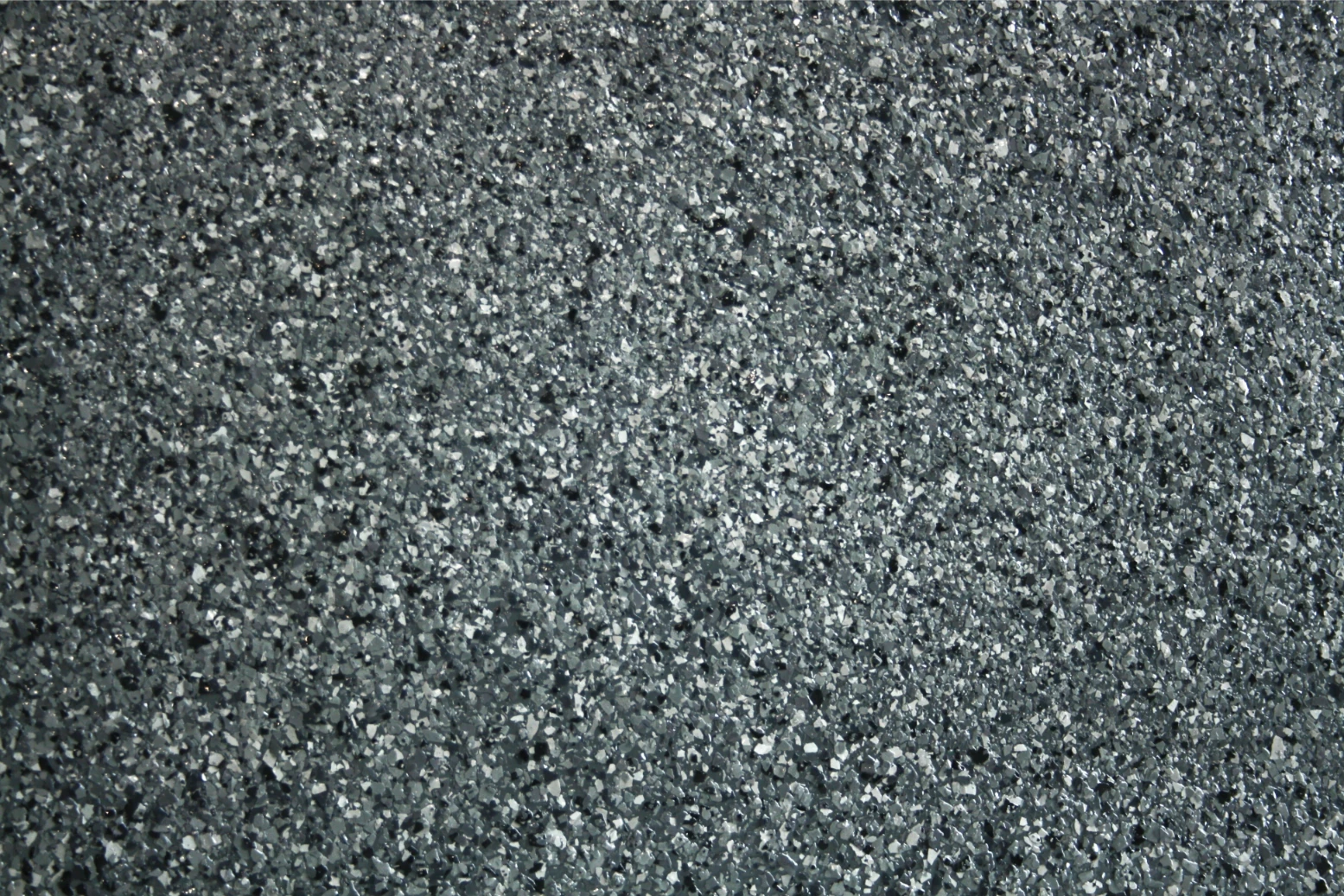 Close-up of textured gray asphalt surface