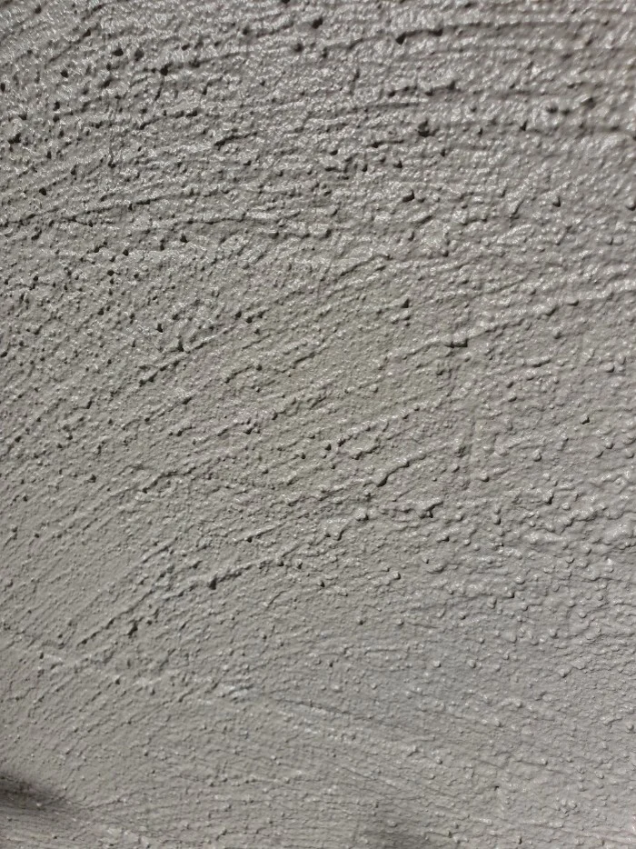 Close-up of textured gray concrete wall