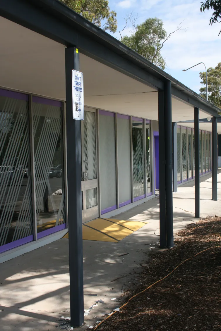 Building corridor with anti-theft signage and protective grilles