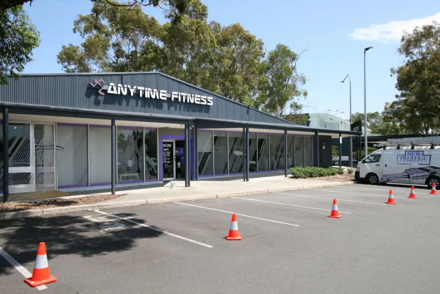 Anytime Fitness gym exterior with parking cones