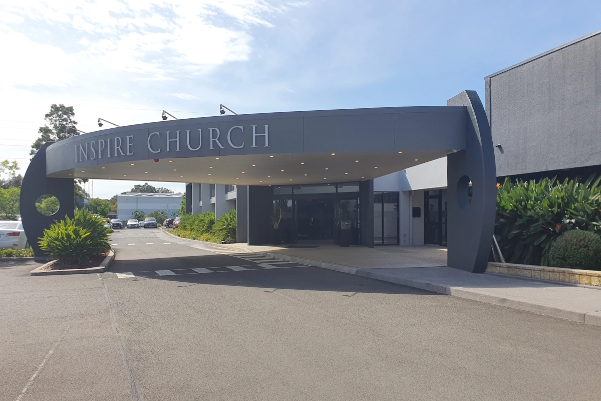 Entrance of Inspire Church with modern canopy design.