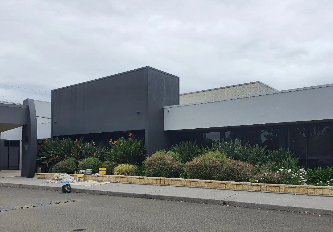 Modern industrial building with landscaped front garden