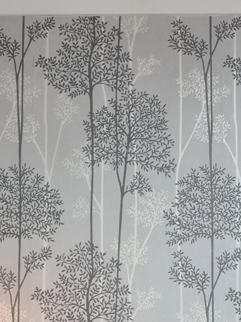 Elegant grey tree patterned curtain in soft light